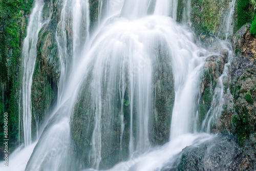 Fototapeta Naklejka Na Ścianę i Meble -  Silky effect waterfalls inside the village of Torbera, Burgos, Castile and Leon, Spain.