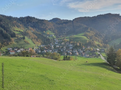 Beautiful slovenia: idyllic landscape with gently green rolling hills and a clear blue sky near Poljane nad Skofjo Loko