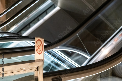 Escalators with safety notices of the dangers of inappropriate use.
