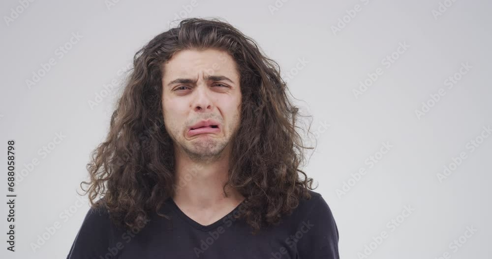 Sad, crying and face of man with depression in studio isolated on a white background. Tears, portrait and person with anxiety, stress or broken heart, trauma or grief, mental health crisis or mistake Sad, crying and face of man with depression in studio isolated on a white background. Tears, portrait and person with anxiety, stress or broken heart, trauma or grief, mental health crisis or mistake