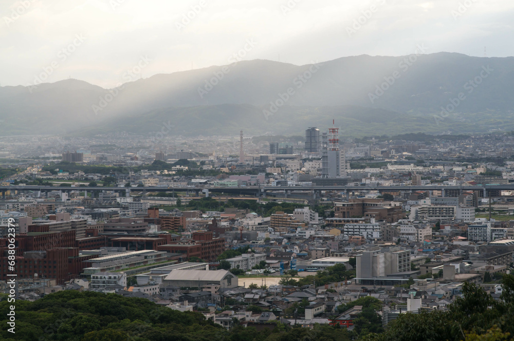 京都 夕刻の伏見稲荷大社の山頂から眺めた京都市内の幻想的な街並み