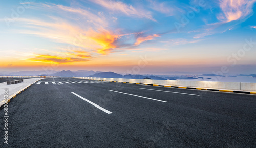 Asphalt highway road and mountain natural landscape at sunset. High Angle view. © ABCDstock