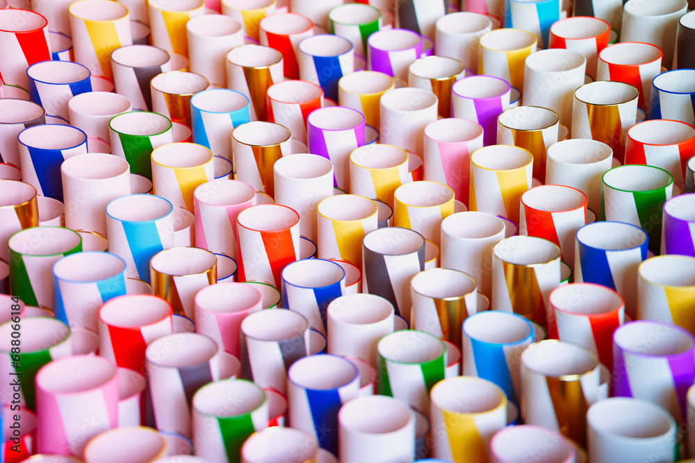 Fototapeta premium Assorted Colorful Paper Rolls Carefully Displayed in a Neat Array