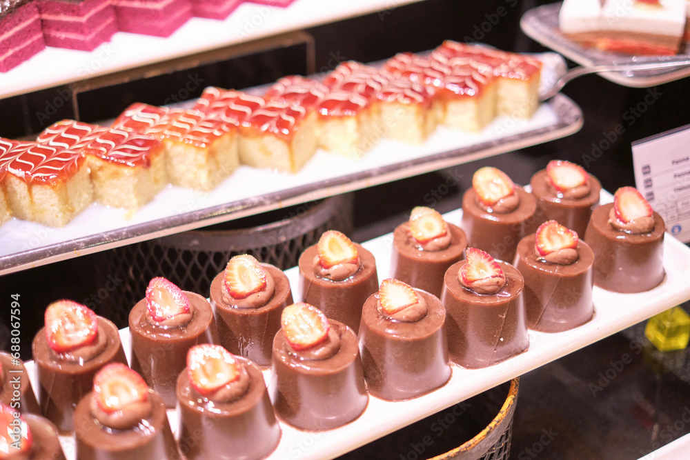 Chocolate squares align in tempting array, a testament to symmetry in food design. Yet, they contrast with sugar-reduction trends. Chocolate squares align in tempting array, a testament to symmetry in food design. Yet, they contrast with sugar-reduction trends.