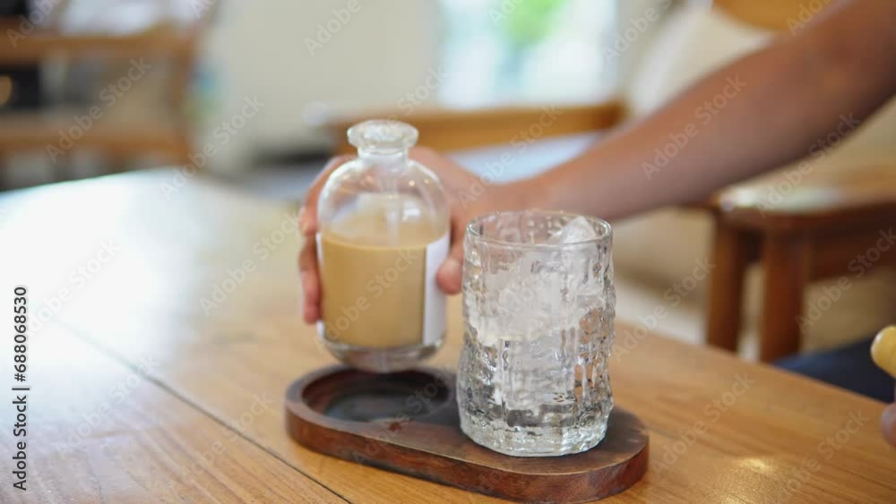 filling coffee into a cup filling coffee into a cup