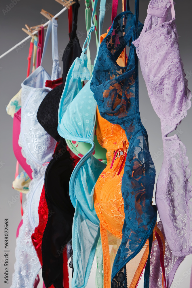 Numerous Colorful Bras Are Hung On A Close Line In A Studio Environment