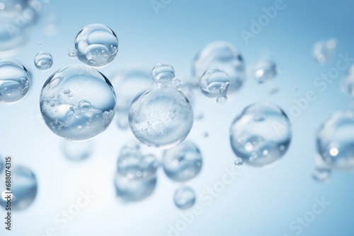 Close-up macro photo of water drops or oil bubbles on blue background.