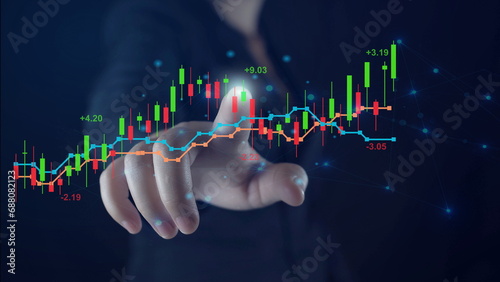 Business growth, progress or success concept.planning and strategy, Stock market, Hand of Businessman or trader touching showing a growing virtual hologram stock on smartphone, invest in trading.