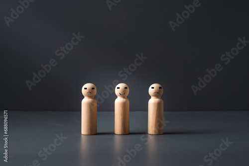 wooden figues on a grey blue background ,concept of marriage guidance or counselling ,help in the family .
