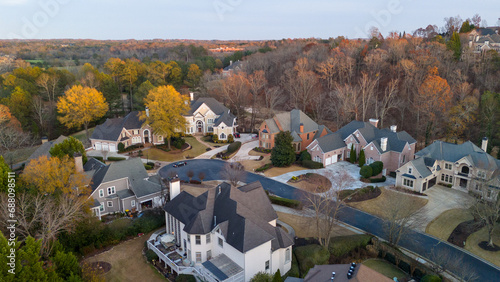 Aerial panoramic view of an upscale subdivision in suburbs of USA shot during golden hour in December 2023