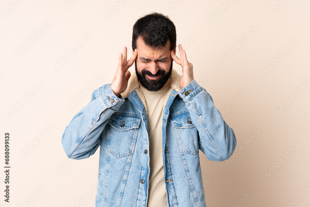 Caucasian man with beard over isolated background with headache Caucasian man with beard over isolated background with headache