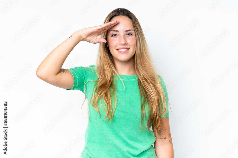 Young caucasian woman isolated on white background saluting with hand with happy expression Young caucasian woman isolated on white background saluting with hand with happy expression