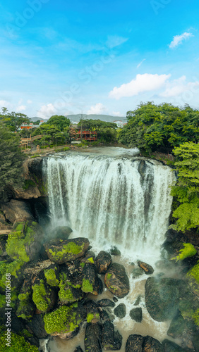 Aerial view of Thac Voi - Elephant waterfall  forest and city scene near Dalat city and Linh An pagoda in Vietnam
