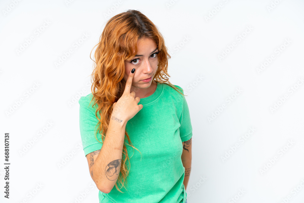 Young caucasian woman isolated on white background showing something Young caucasian woman isolated on white background showing something