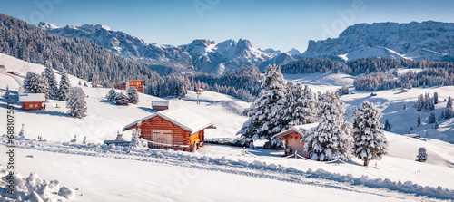 Panoramic morning view of Alpe di Siusi village. Bright winter landscape of Dolomite Alps. Snowy outdoor scene of ski resort, Ityaly, Europe. Vacation concept background.