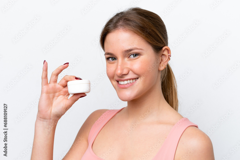 Young caucasian woman isolated on white background with moisturizer Young caucasian woman isolated on white background with moisturizer