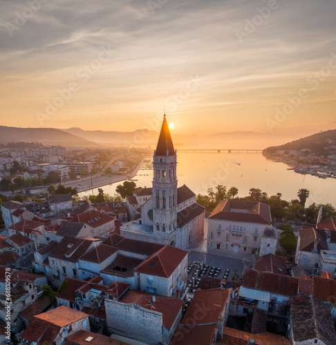 Amazing panoramic view of the picturesque town of Trogir in Croatia, the old town with beautiful historic buildings bathed in morning light, at the Adriatic Sea coast. photo