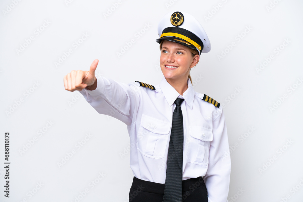 Airplane caucasian pilot woman isolated on white background giving a thumbs up gesture
