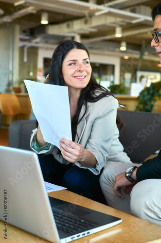 A businesswoman showing data to her coworker