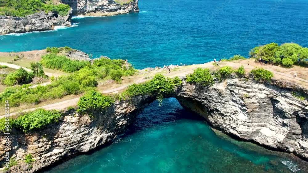 Aerial video of Kelingking Beach, Nusa Penida is one of the most incredible place for visit in Indonesia the eyes of travelers have a view amazing natural landscape. Aerial video of Kelingking Beach, Nusa Penida is one of the most incredible place for visit in Indonesia the eyes of travelers have a view amazing natural landscape.