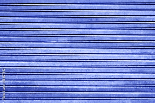 Metal stripes pattern. Ventilation grille texture. Industrial iron metal bars. Grunge grid lines. Blue color industrial background.
