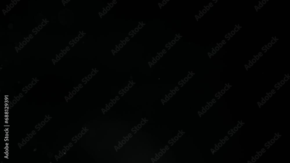 floating particles in the air. Macro of small particles with bokeh effect. Dust video effect for overlay floating particles in the air. Macro of small particles with bokeh effect. Dust video effect for overlay