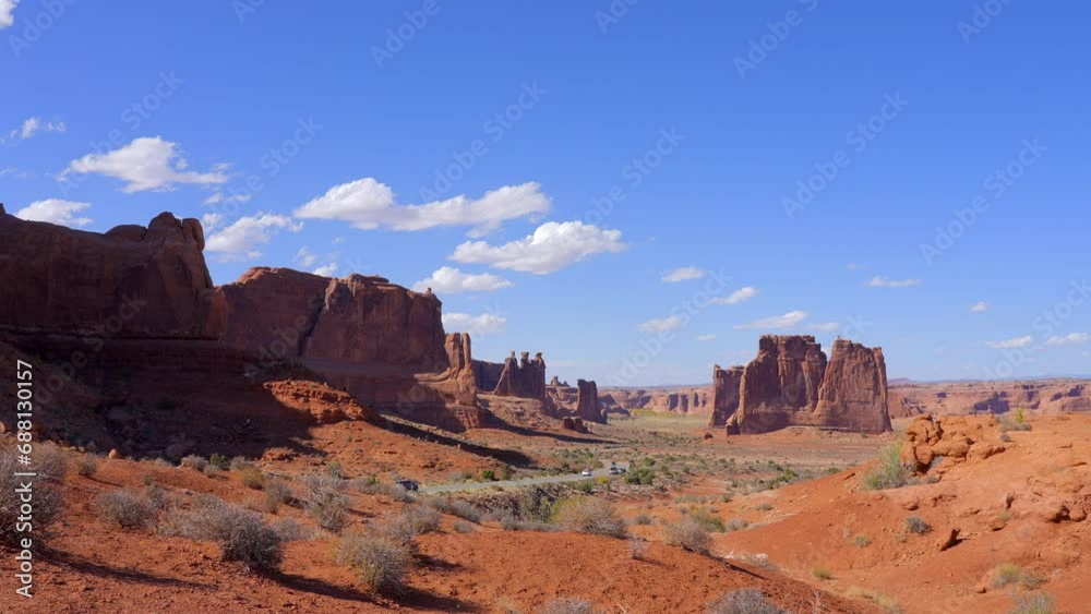 Establishing shot of mountain trail with red rocks background in La Sal Mountains, Arches National Park, Utah, North America. Day time on October 2023. Still camera view. ProRes 422 HQ. Establishing shot of mountain trail with red rocks background in La Sal Mountains, Arches National Park, Utah, North America. Day time on October 2023. Still camera view. ProRes 422 HQ.