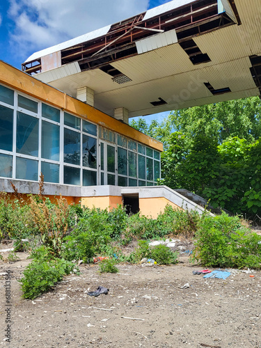 Old run-down gas station with gas pumps as a lost place in Wallachia in Romania photo