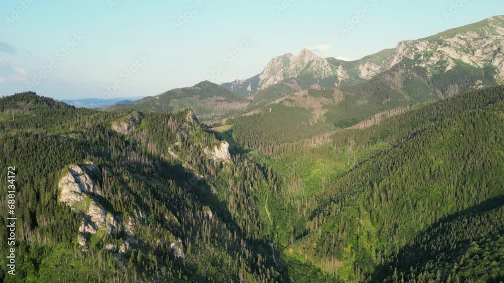 Beautiful mountain landscape in summer, forest and rocks. Zakopane, Poland. Aerial footage of Tatras mountain Poland Zakopane drone footage. Mountain range with green forest and blue orange sunset sky Beautiful mountain landscape in summer, forest and rocks. Zakopane, Poland. Aerial footage of Tatras mountain Poland Zakopane drone footage. Mountain range with green forest and blue orange sunset sky