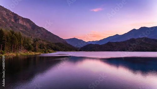lake surrounded by forested mountains under a purple sky at sunset © Paula