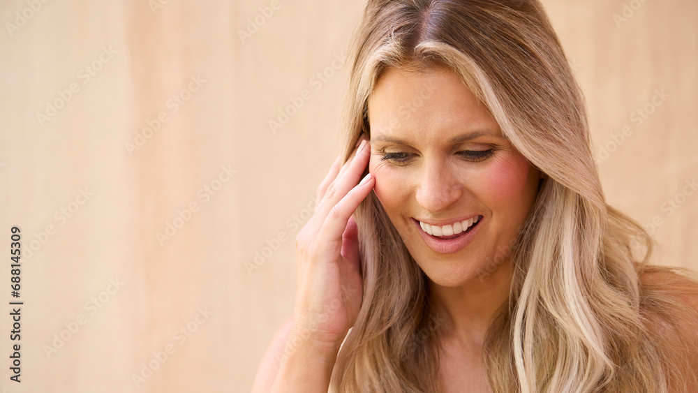 Beauty Portrait Of Smiling Mature Woman With Bare Shoulders Against Natural Background Beauty Portrait Of Smiling Mature Woman With Bare Shoulders Against Natural Background