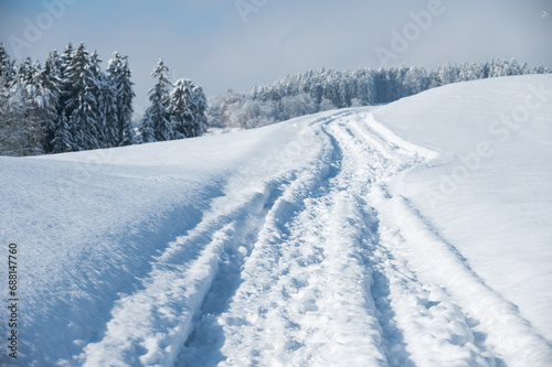 Path through the snow on a sunny day
