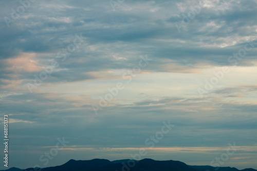 Fototapeta Naklejka Na Ścianę i Meble -  Peaceful romantic sky with soft pastel clouds surrounded by cozy environment 