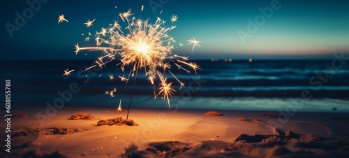 Sylvester New Year, Vacation holiday New Year's Eve 2024 party event celebration holiday greeting card - Closeup of sparkling sparkler stuck in sand on beach with ocean in teh background photo