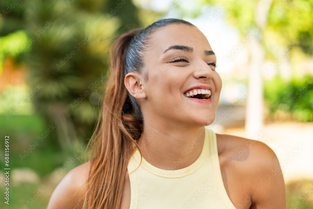 Young pretty woman at outdoors With happy expression Young pretty woman at outdoors With happy expression