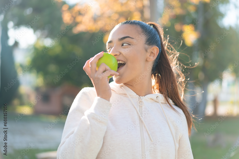Young pretty sport woman holding an apple Young pretty sport woman holding an apple