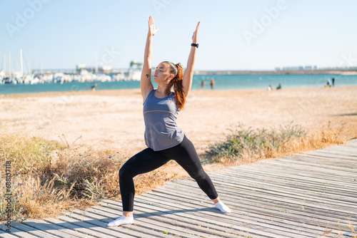 Young pretty sport woman doing yoga
