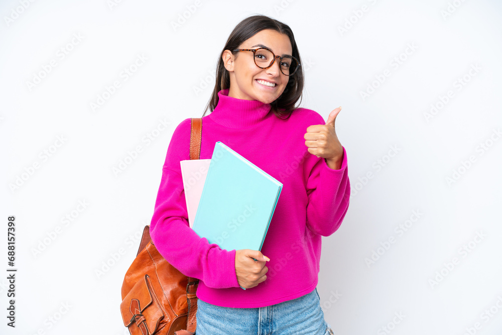 Young student woman isolated on white background giving a thumbs up gesture Young student woman isolated on white background giving a thumbs up gesture
