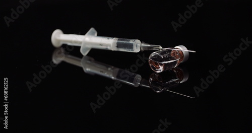 Fototapeta Naklejka Na Ścianę i Meble -  Syringe and Medicine on Black Background Isolated