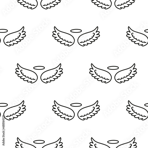 Seamless pattern with angel wings and nimbus.