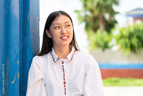 Young Chinese woman at outdoors . Portrait photo