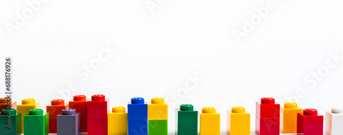 Pile of colorful lego building blocks on a white background. Educational game photo
