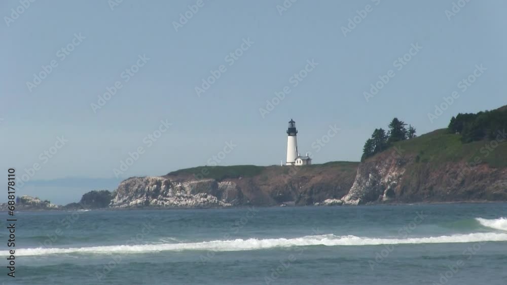 Ocean Waves With Lighthouse Up On Cliff In Background Blue Sky White Clouds Newport Oregon
Ocean Waves With Lighthouse Up On Cliff In Background Blue Sky White Clouds Newport Oregon