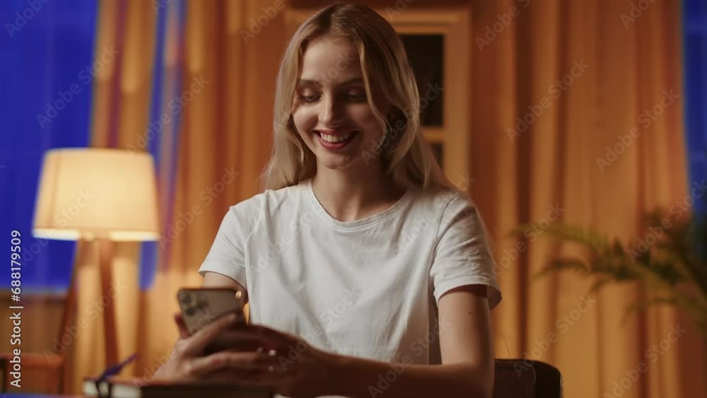 A young blonde girl with a sad mood uses the smartphone and unexpectedly receives notification about winning a large sum of money in lottery. A lady enrollee finds out successful admission to A young blonde girl with a sad mood uses the smartphone and unexpectedly receives notification about winning a large sum of money in lottery. A lady enrollee finds out successful admission to