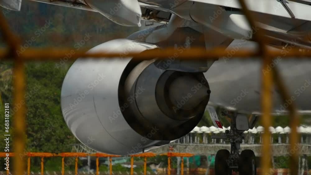 Huge airplane jet engine close up view moving forward heat haze. Landing gear Huge airplane jet engine close up view moving forward heat haze. Landing gear