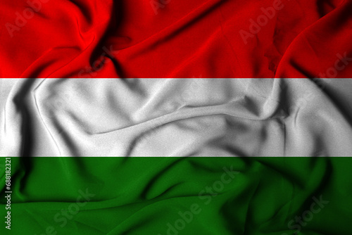 Selective focus Hungarian Flag, with waving cloth texture. 3D illustration