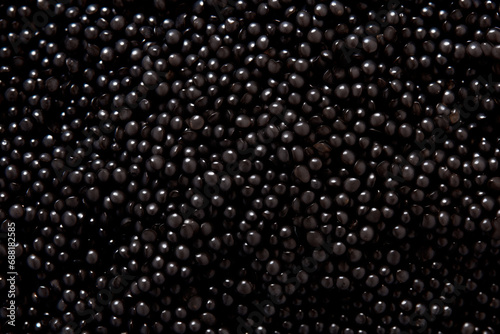 Closeup of natural black caviar as background, texture of expensive luxury fresh sturgeon caviar macro photo.
