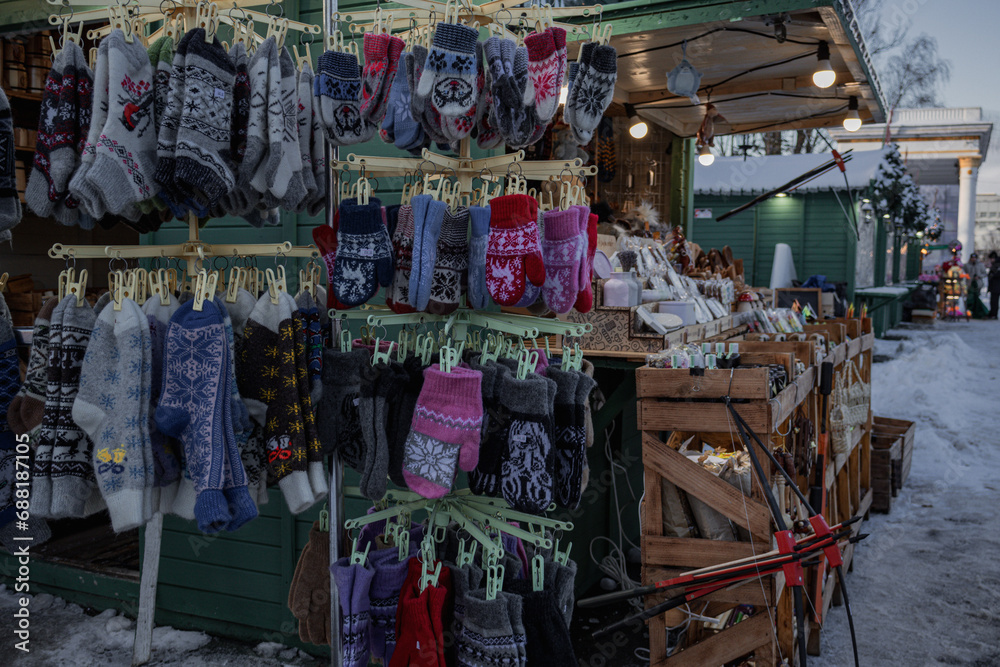 Obraz premium Kyiv, Ukraine. 04.12.2023: New Year's toys and socks and gloves are sold at the New Year's fair