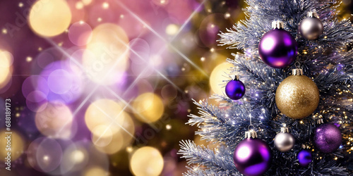 Decorated Christmas tree with purple and gold baubles on bokeh background