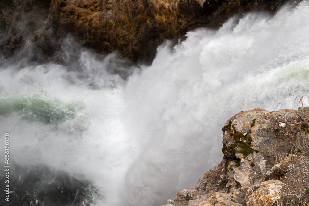 Top of the most famous waterfall in Yellowstone National Park is the Lower Yellowstone River Falls with an impressive 308-foot drop Image shows the calm flowing water and the white water as it descend